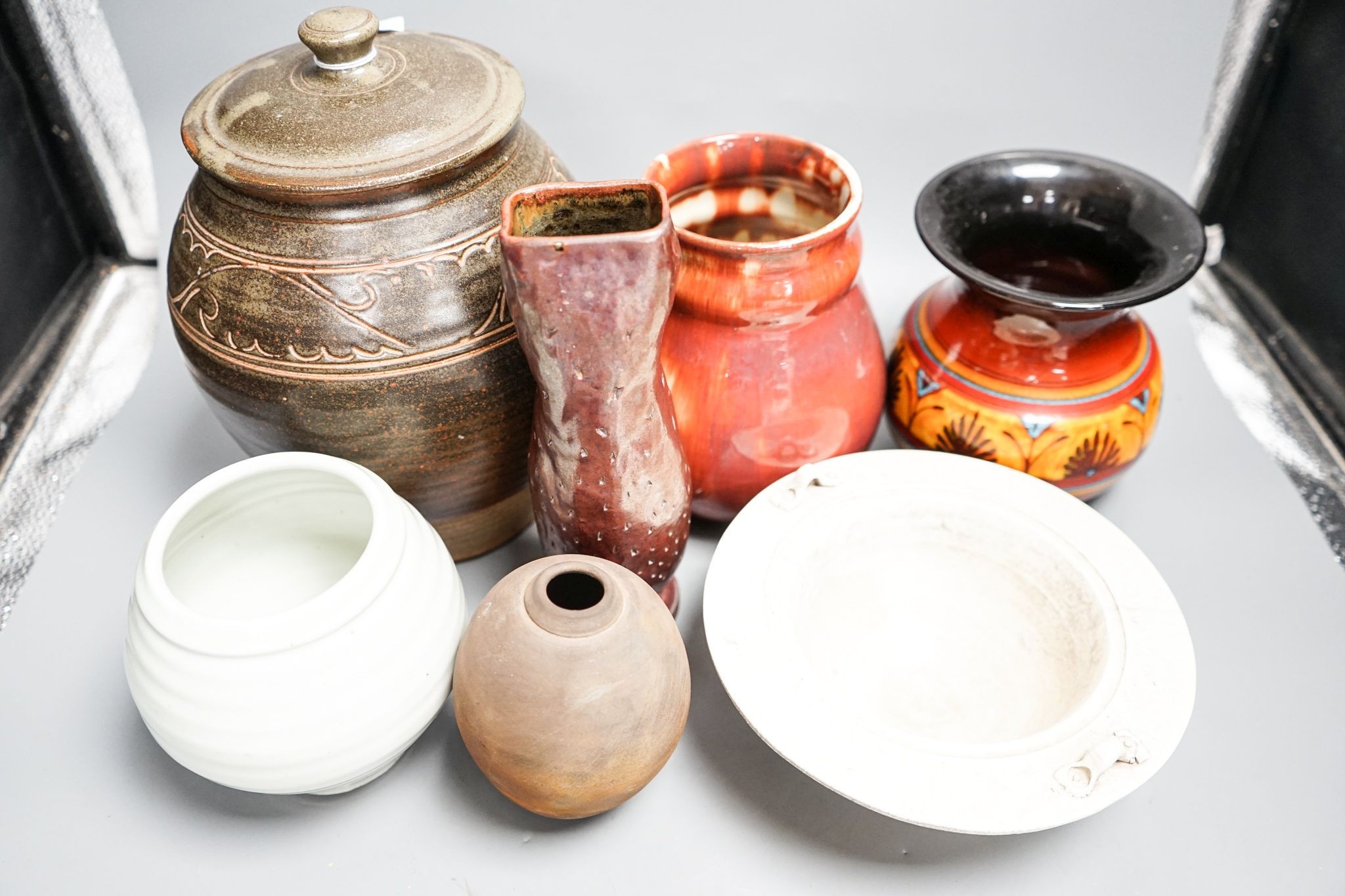A group of studio pottery including a jar and cover, probably Norah Braden, 25 cm